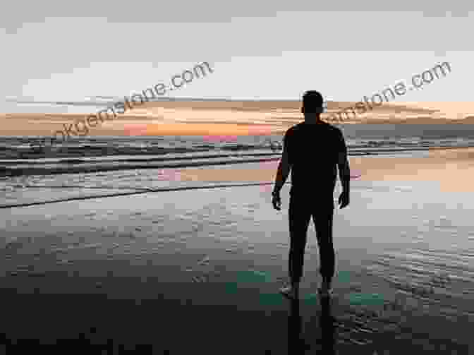 A Photo Of A Person Sitting On A Beach, Looking Out At The Ocean, With A Backpack Next To Them. Arctic Circle To Austin Texas: My Nomadic Experiment / II