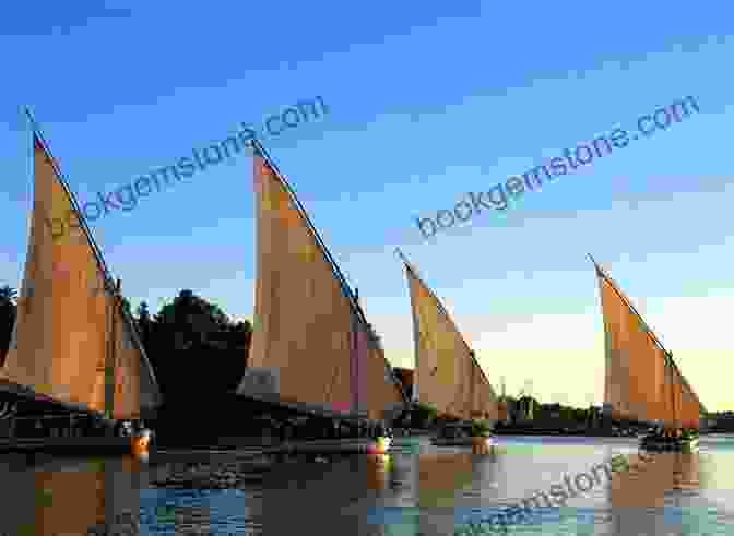 A Traditional Felucca Sailboat Gliding Along The Tranquil Nile River Egyptian Mythology: A Traveler S Guide From Aswan To Alexandria