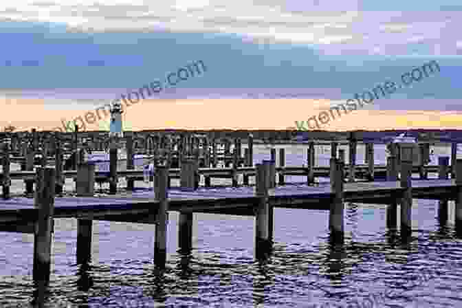 A View Of A Beach On Cape Cod, With A Wooden Pier And Lighthouse In The Background Three Weeks On The Mainland: A Bicycle Journey Through New Zealand S South Island